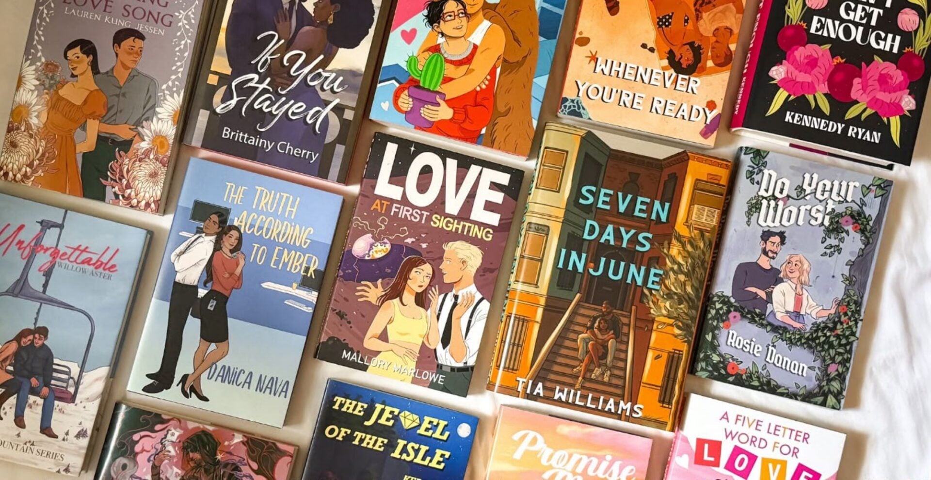 A collection of romance books, all with brightly coloured covers.