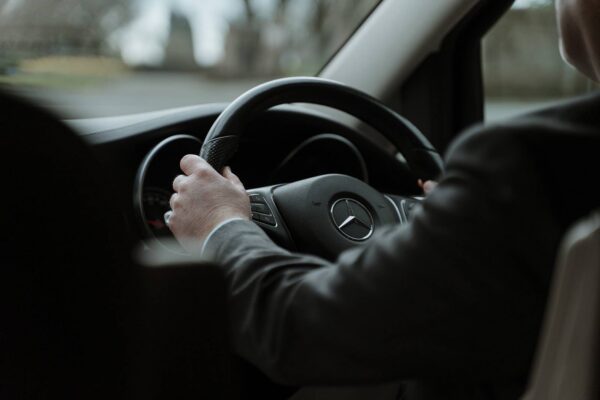 Little's Chauffeur Drive driver hands and steering wheel