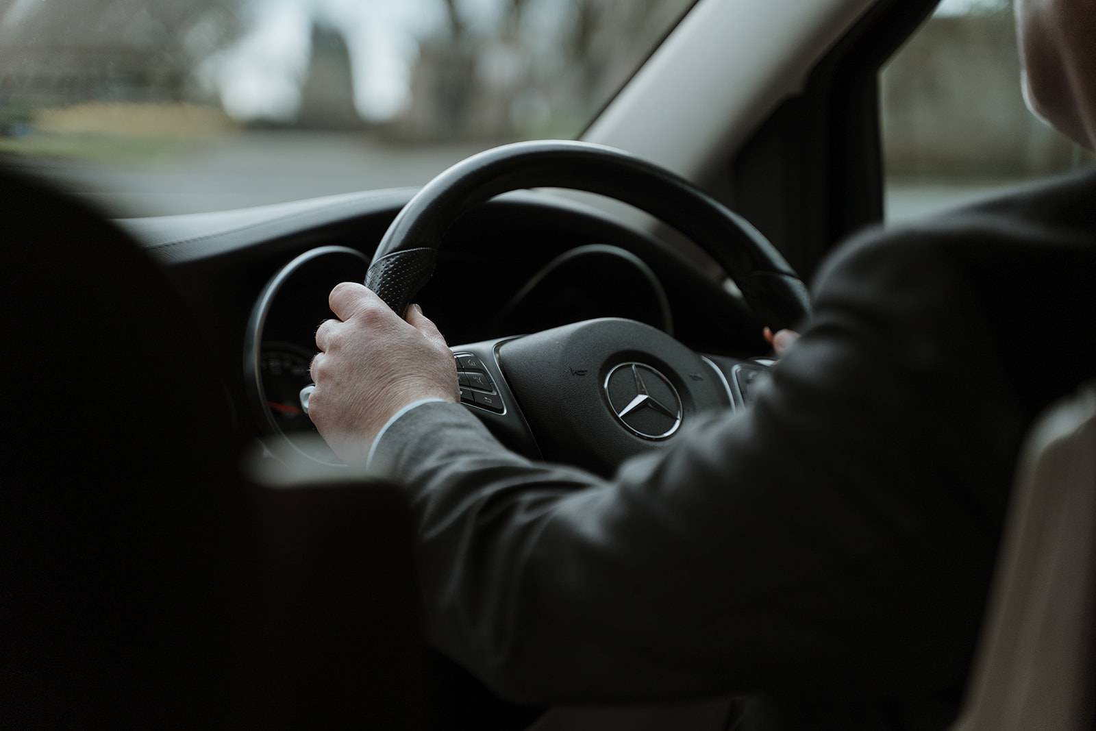 Little's Chauffeur Drive driver hands and steering wheel