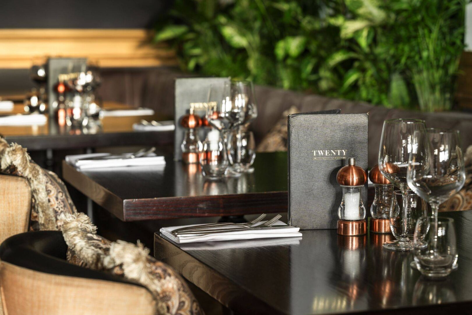 3 tables with glassware and menus