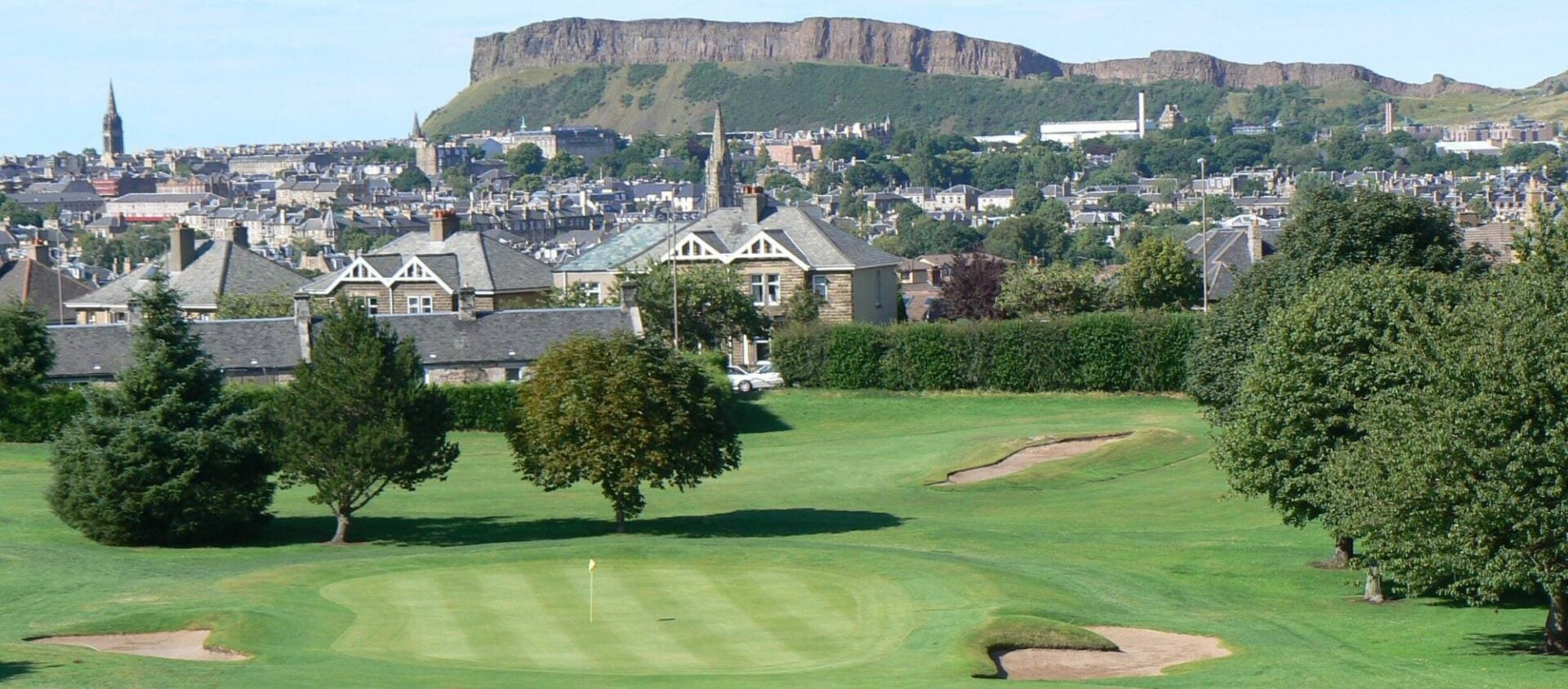 Craigmillar Park Golf Club with view of Salisbury Crags behind