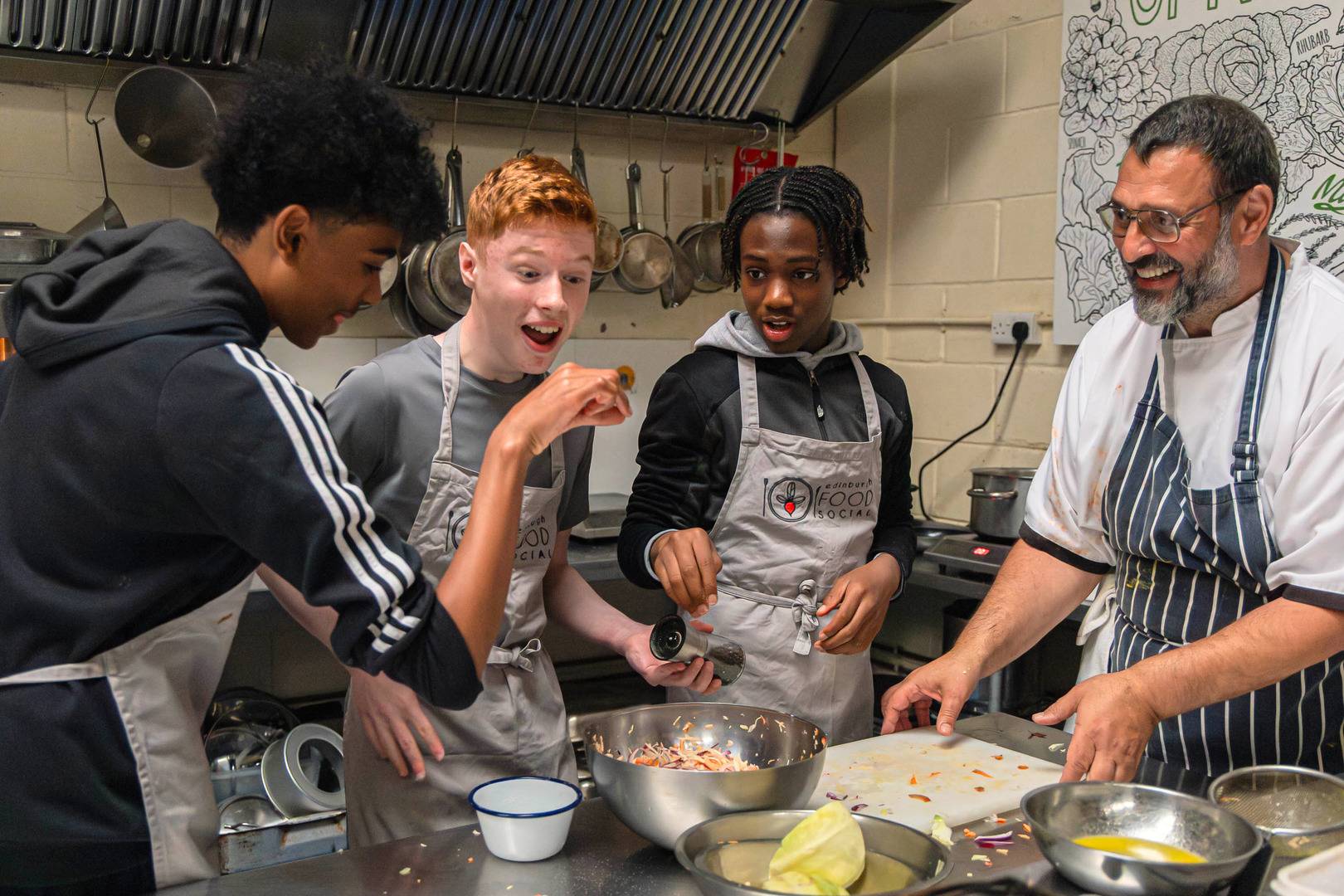 Young people taking part in a cookery lesson at Edinburgh Food Social